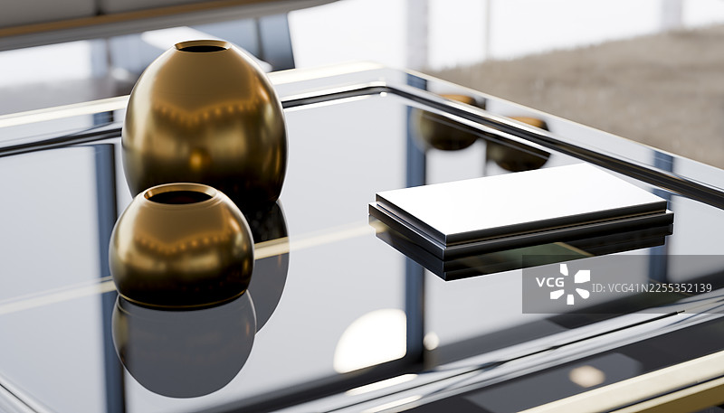 现代咖啡桌上的金色花瓶和空白名片图片素材