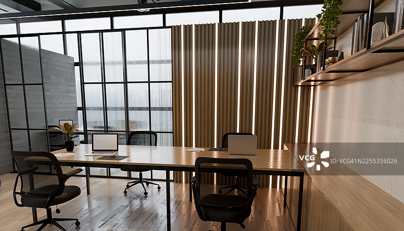 现代开放式办公室内部，配有两台笔记本电脑图片素材