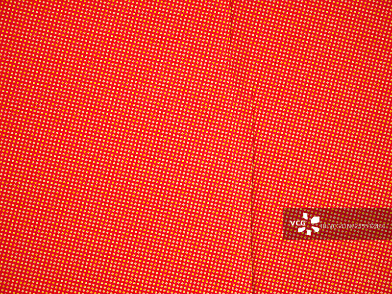 带黄色和白色圆点和折痕的红纸图片素材