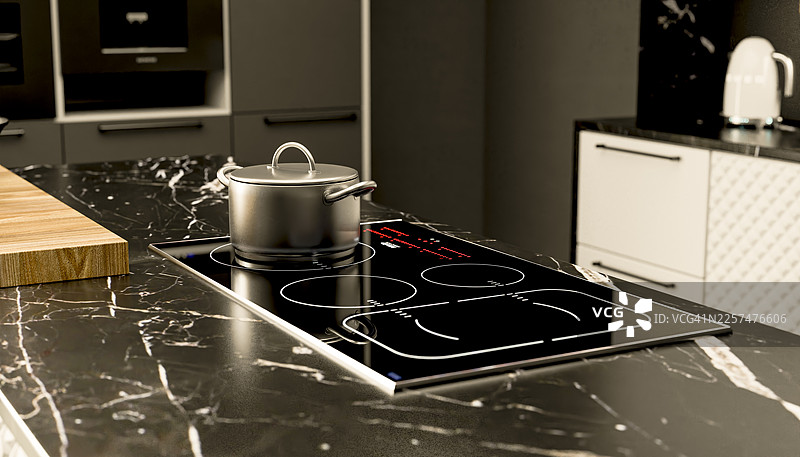 现代厨房岛台，配有电磁炉和石材台面图片素材