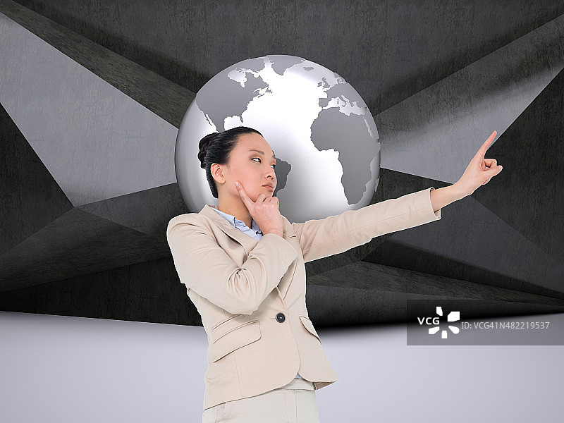 沉思的女商人指向某处的合成图像图片素材