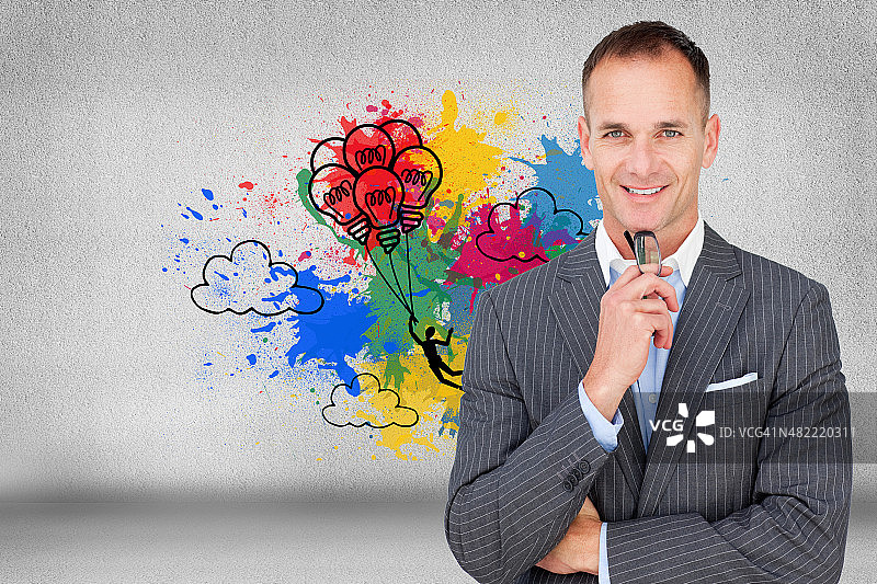 商务人士拿着眼镜的合成图像图片素材