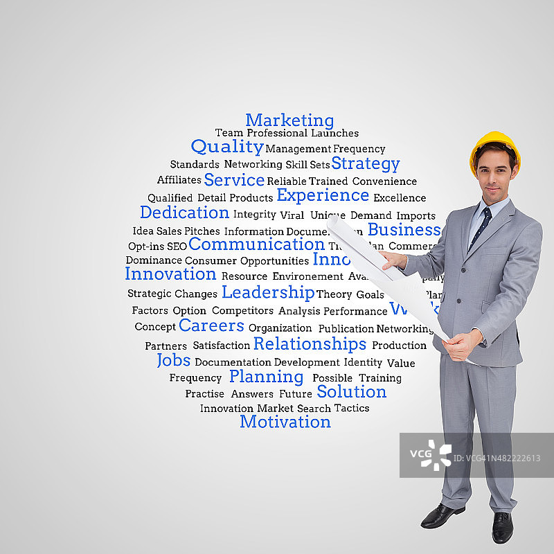 戴安全帽的建筑师手持图纸合成图像图片素材