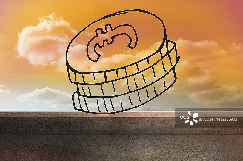 橙色天空上的硬币图片素材