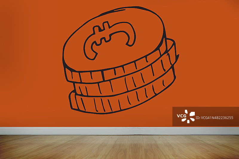 橙色墙上的硬币图片素材