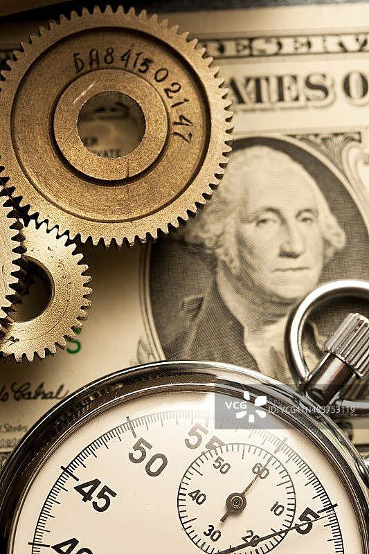 机械棘轮、秒表和美元图片素材