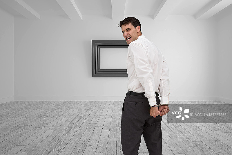 戴着手铐的年轻商人背影合成图像图片素材