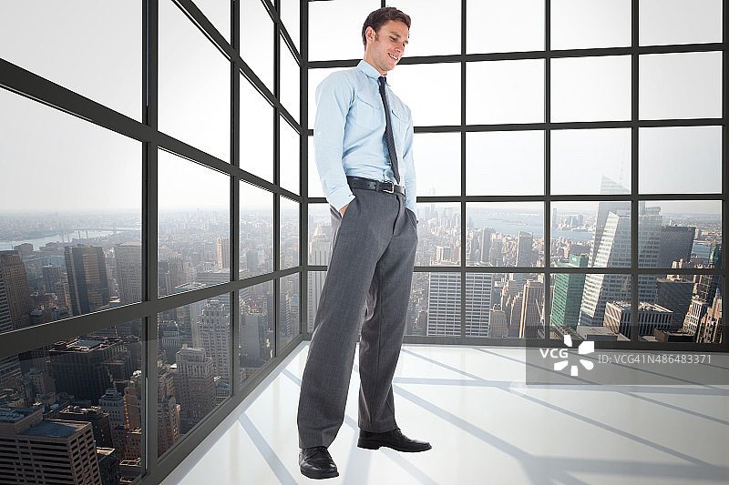 快乐的商人双手插在口袋里的合成图像图片素材