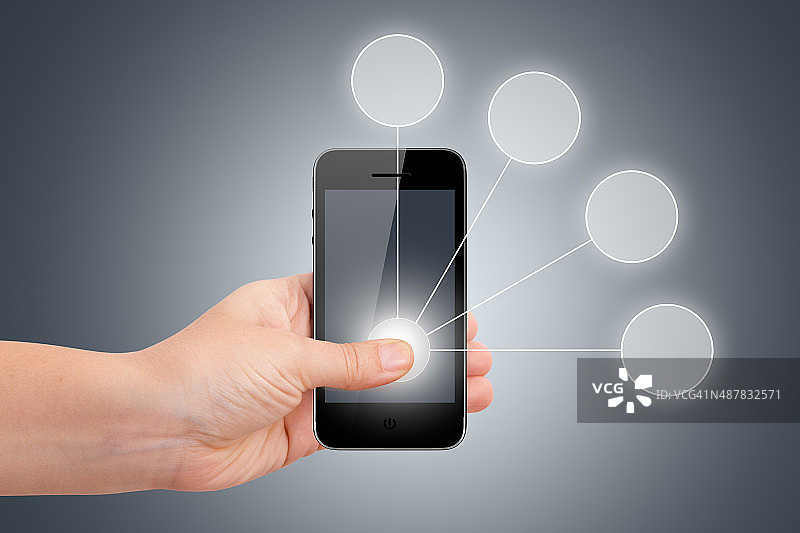 手持带圆形按钮的智能手机图片素材