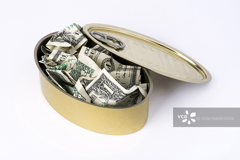 黄色食品罐中的美元图片素材
