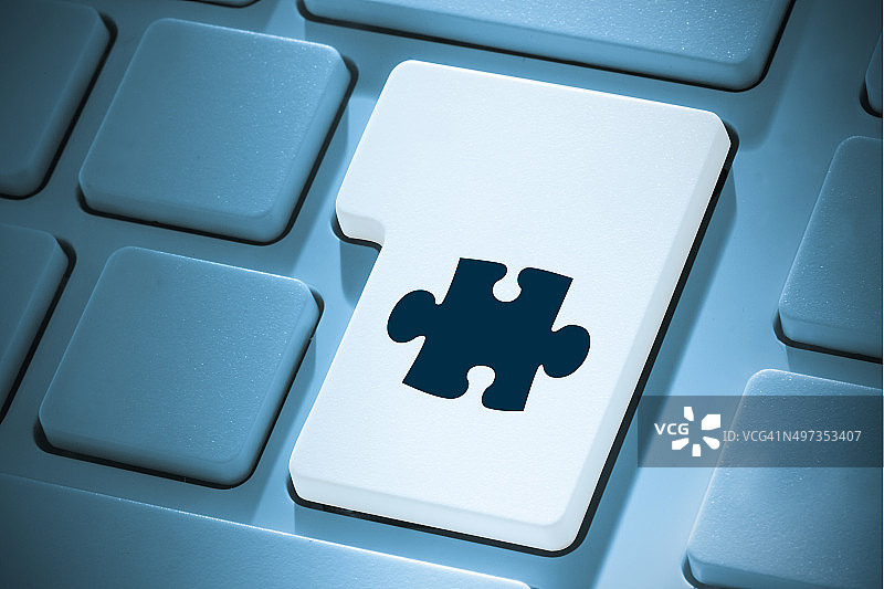 在回车键上的拼图块合成图像图片素材