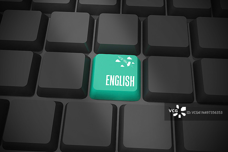 黑色键盘上的绿色 English 键图片素材