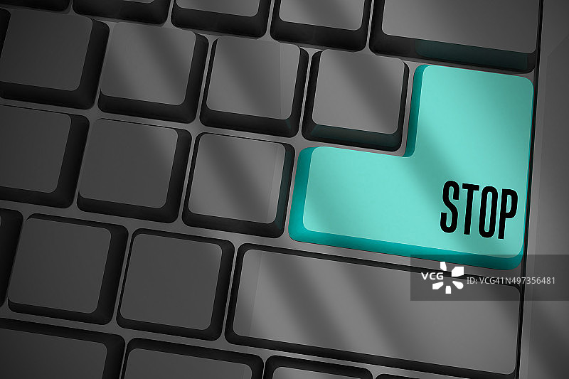 黑色键盘上的蓝色停止键图片素材