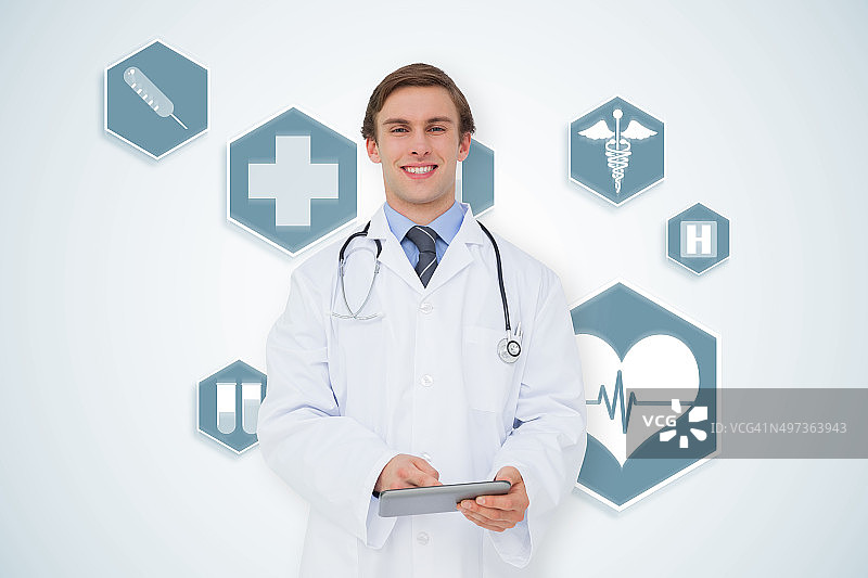 使用平板电脑的年轻医生的合成图像图片素材