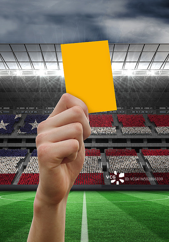 举起黄牌的手的合成图像图片素材