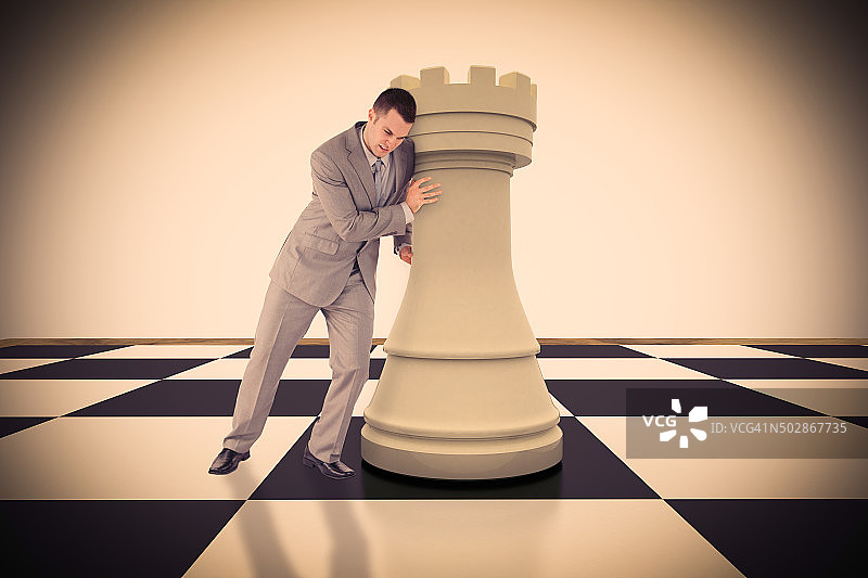 英俊商人推动棋子的肖像合成图像图片素材