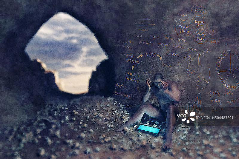 穴居人使用平板电脑解决业务问题图片素材