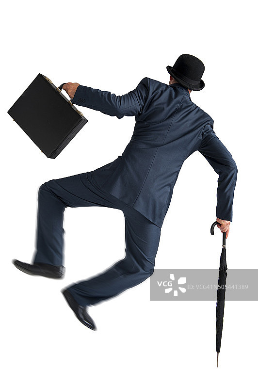 商人跳跃，高举双脚，白色背景图片素材