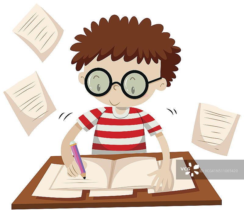 在桌子旁写作的男孩图片素材