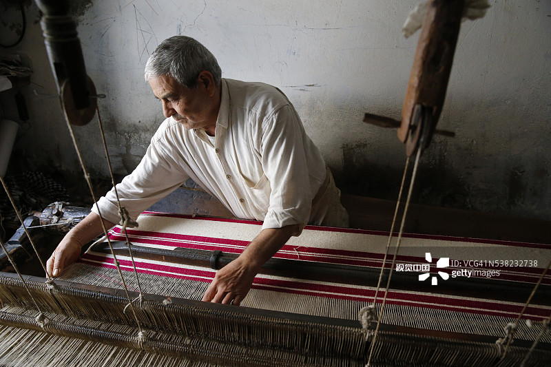 莫纳斯蒂尔老城的手工织布工图片素材