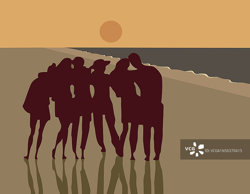 一群人在日落时分的海滩上图片素材