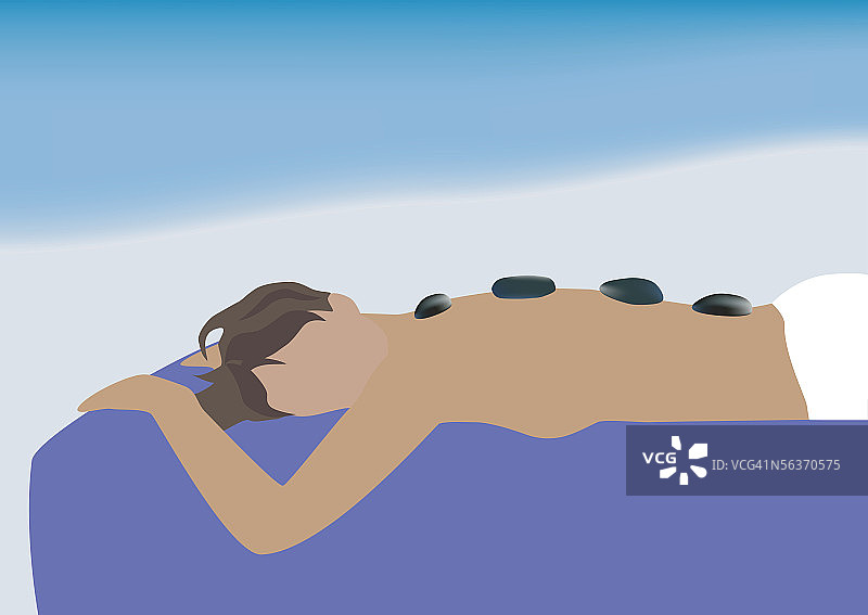 背部放着治疗石的女性侧面照图片素材