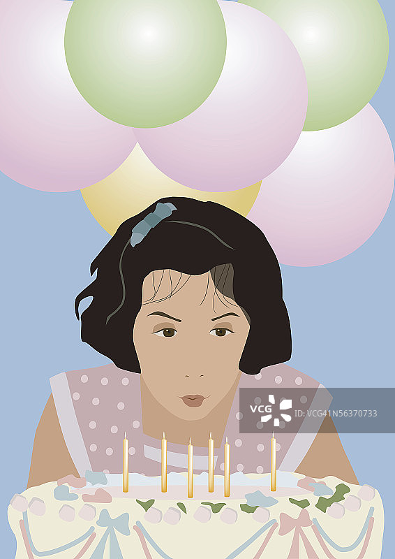 女孩吹灭生日蛋糕上的蜡烛图片素材