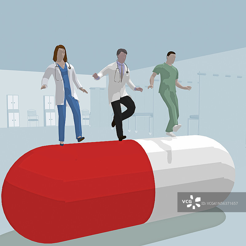 在胶囊上滚动的三个医生的低角度视图图片素材
