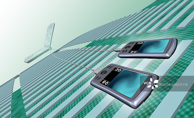 连接到笔记本电脑的两个个人数据助手图片素材