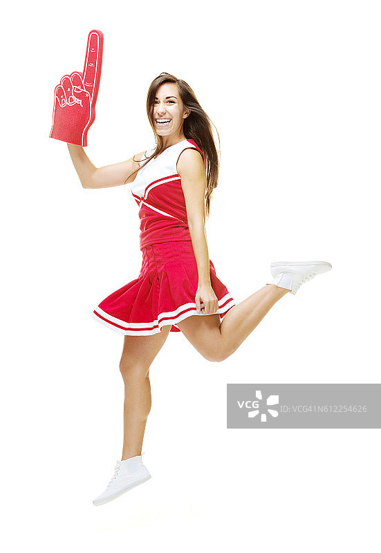 微笑的啦啦队长跳跃图片素材