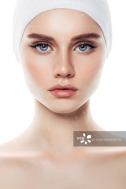 以箭头作为面部按摩模型的女人脸庞图片素材