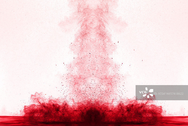 红色粉末颗粒云在白色背景上的爆炸图片素材