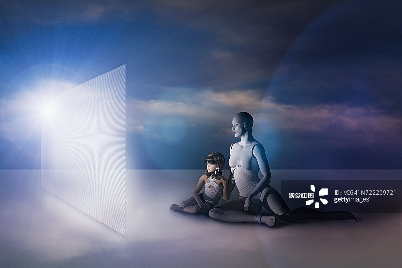 白人女性机器人和女孩坐在地板上看虚拟屏幕图片素材
