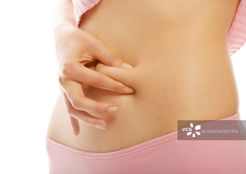 女人用手捏腹部赘肉图片素材
