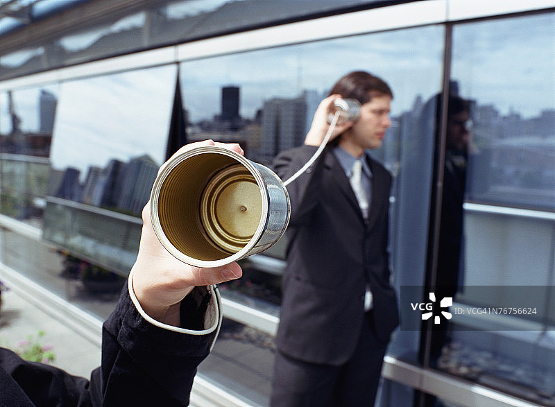 锡罐电话和商人图片素材