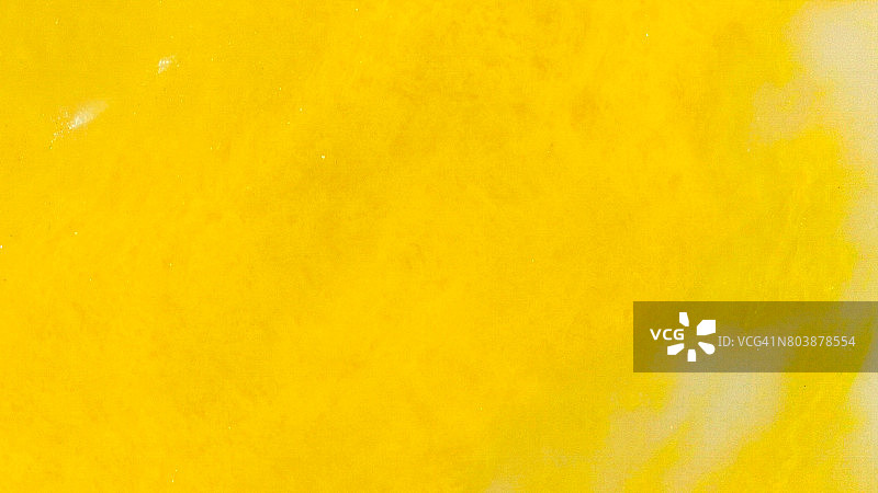 鲜艳的黄色油彩漩涡图片素材