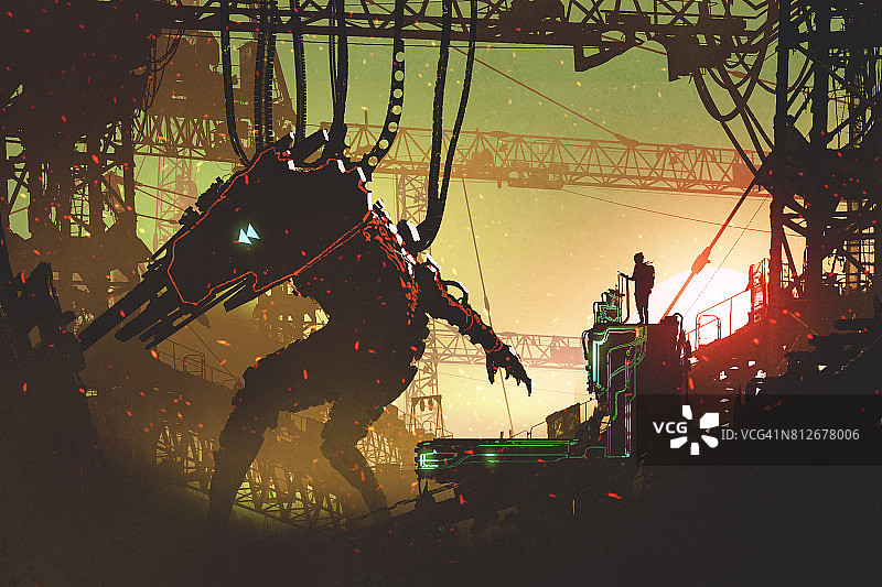 男人用遥控器操作机器人图片素材