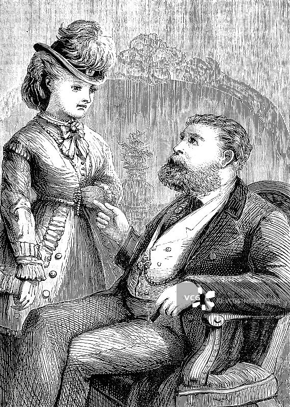 男人坐在椅子上与站立的女人交谈图片素材