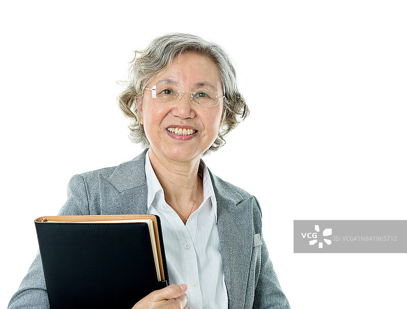 亚洲年长女商人拿着文件夹图片素材