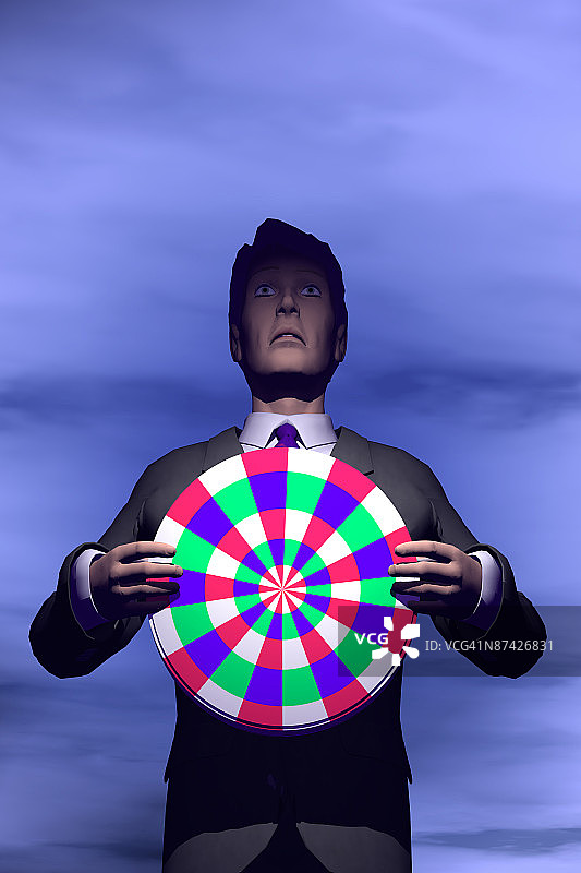 一位商务男人胸前抱着一个目标，站在蓝天下图片素材