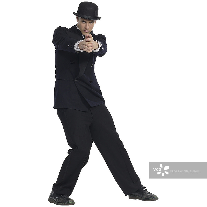 戴着帽子，穿着燕尾服的男人图片素材