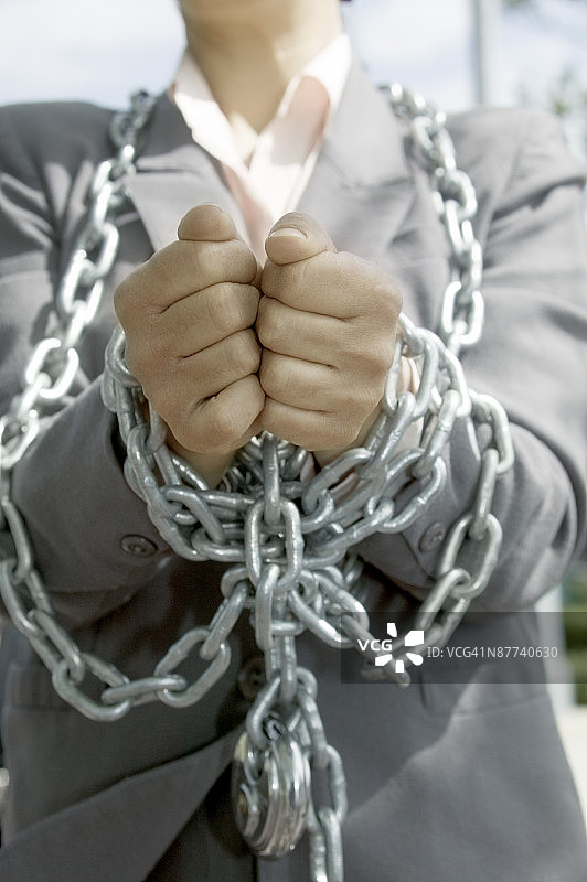 被锁链束缚的商人图片素材