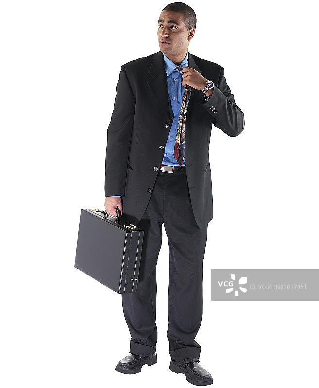 放松领带的商人图片素材