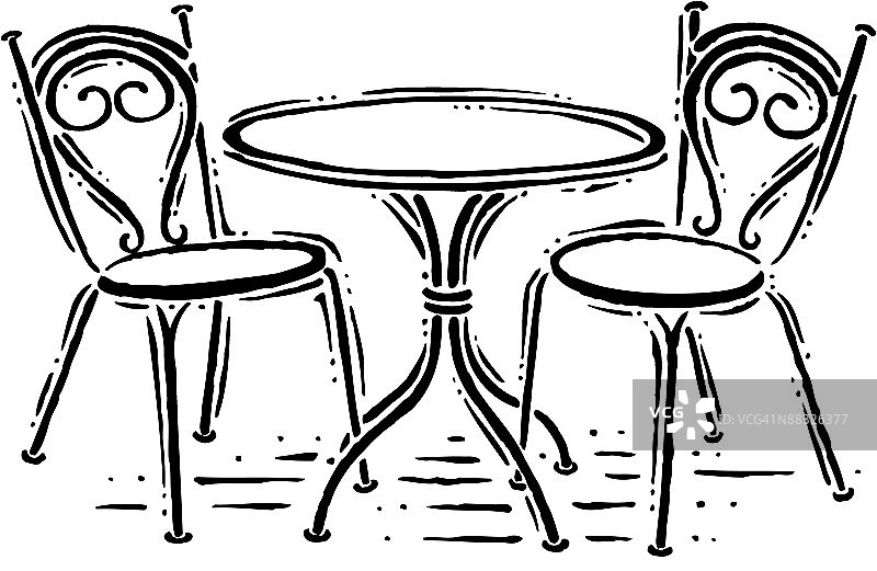 带有配套椅子的圆形小桌子图片素材