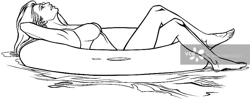 漂浮在游泳圈上的女人图片素材