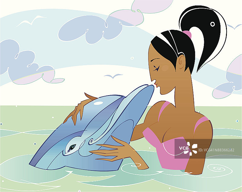 一位年轻的非裔美国成年女性在海洋中亲吻海豚图片素材