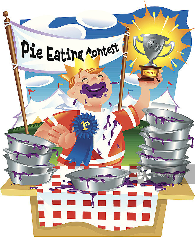 一名白人男子青少年在吃馅饼比赛获胜后举起奖杯图片素材