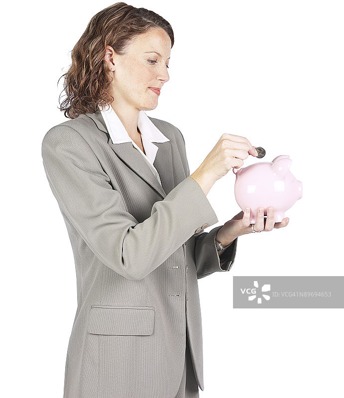 拿着小猪存钱罐的女人图片素材