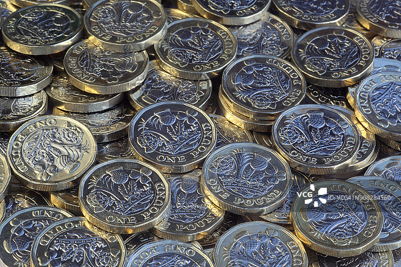 全新闪亮的一英镑硬币图片素材