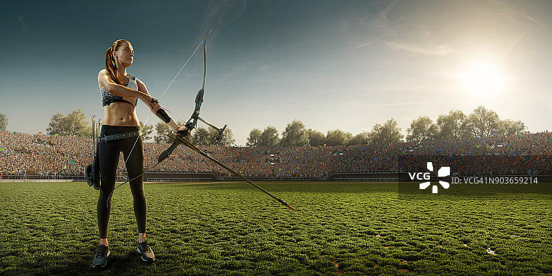 日落时分用长弓射箭的女性弓箭手图片素材